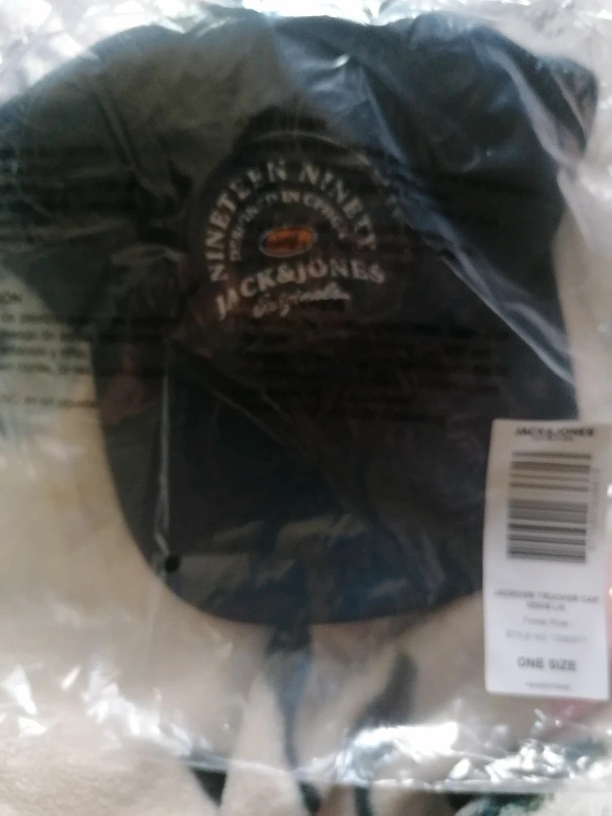 Jack & Jones black and navy trucker cap with logo patch and mesh back.