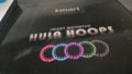 Kmart black and pink hula hoop with smooth surface and lightweight design.