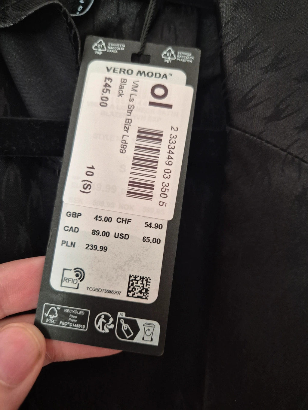 Amy Lynn black coat with satin sheen, ruched detailing, and plunge V-neckline.