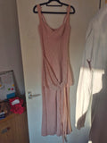 Pink linen maxi dress with sequin embellishments and elegant draped detailing.