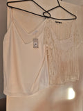 New Look cream and white vests, one with tags, casual style.
