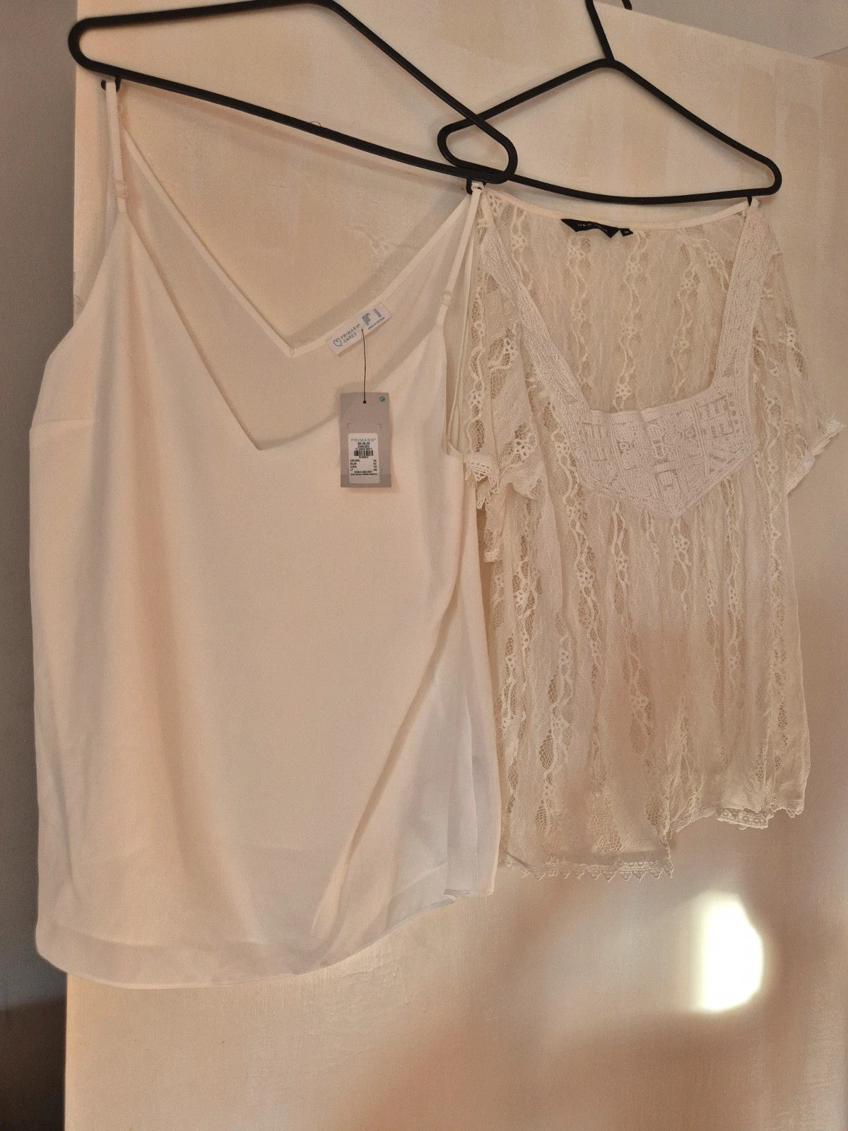 New Look cream and white vests, one with tags, casual style.