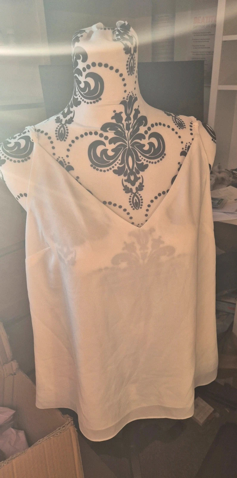 New Look cream and white vests, one with tags, casual style.