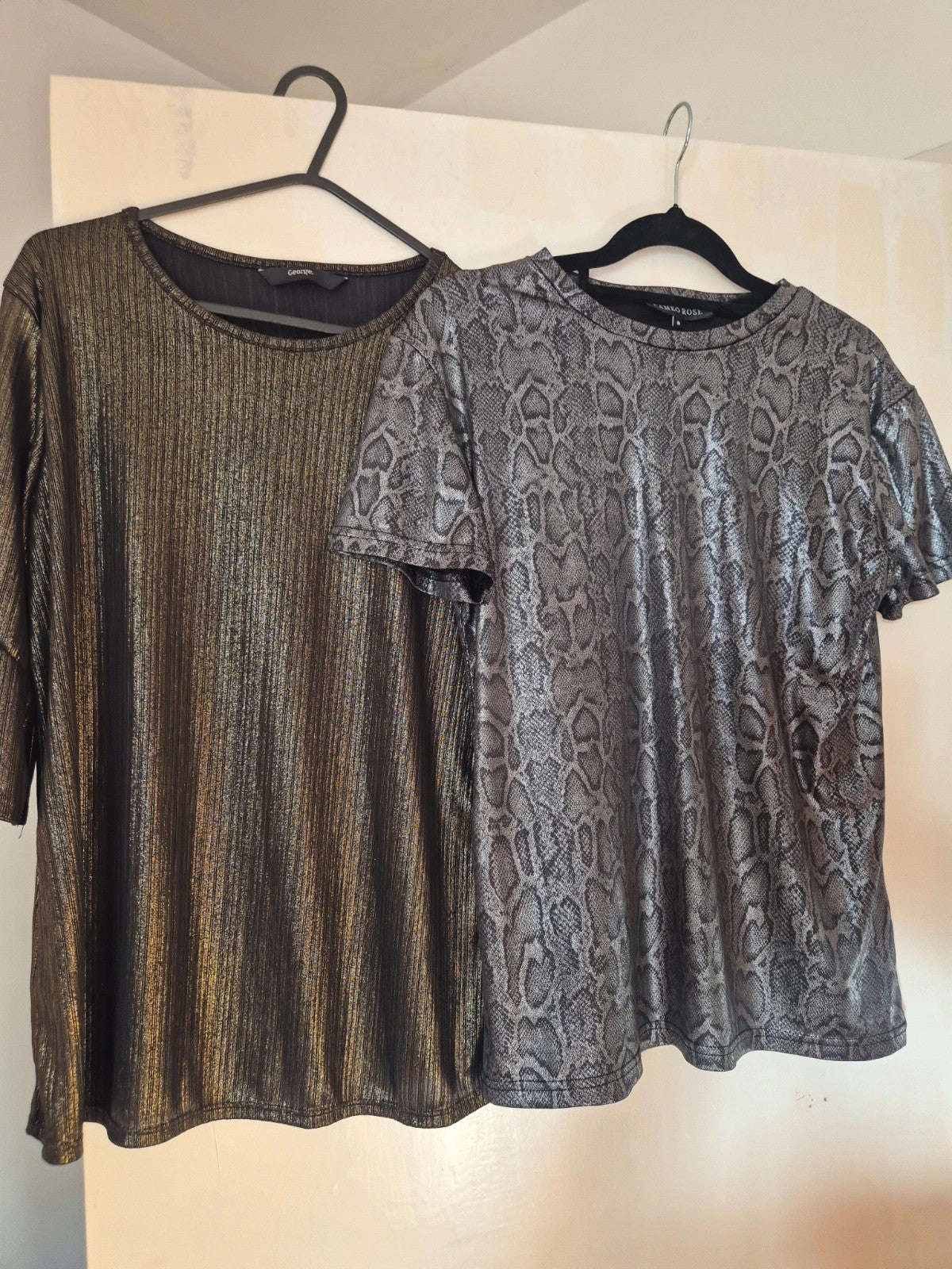 Cameo Rose black and gold top with elegant design, in mint condition.