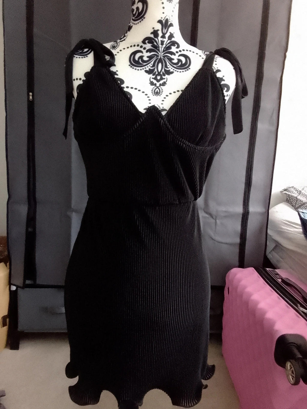 PrettyLittleThing black floral midi dress with elegant design and lightweight material.