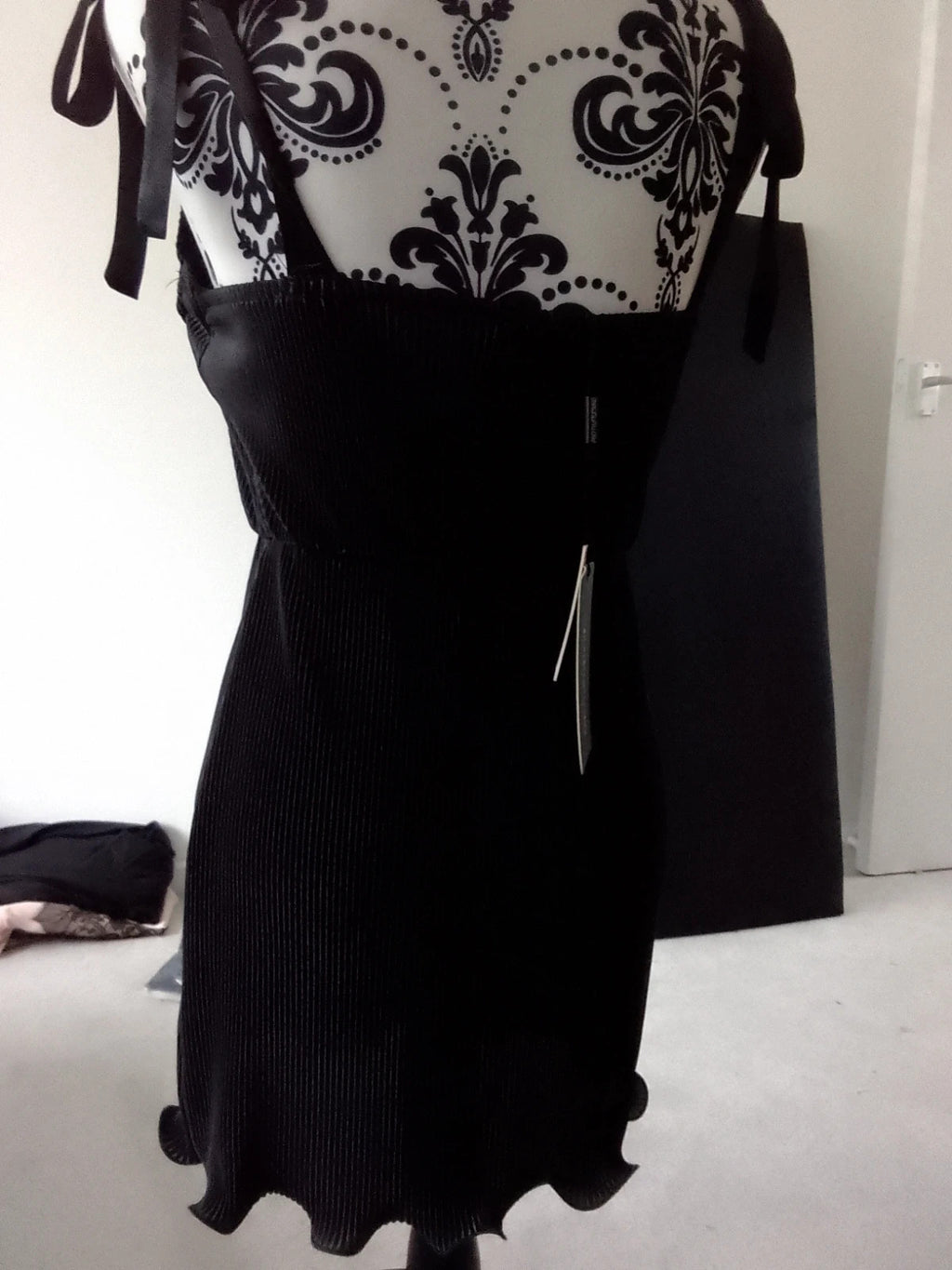 PrettyLittleThing black floral midi dress with elegant design and lightweight material.