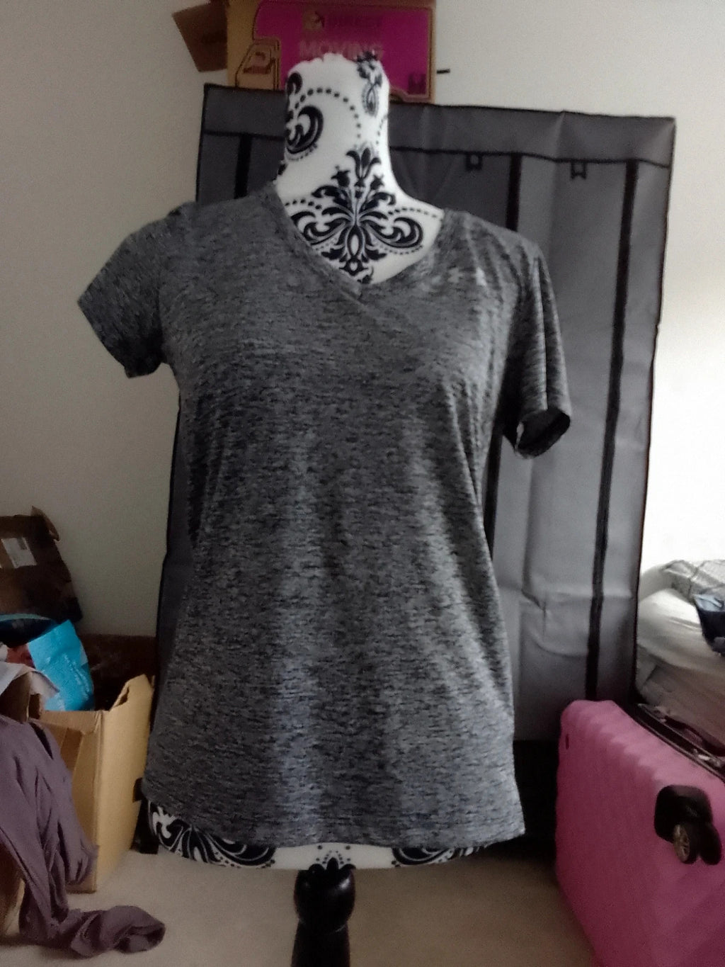 Under Armour black and grey pocket t-shirt with logo, suitable for active wear.
