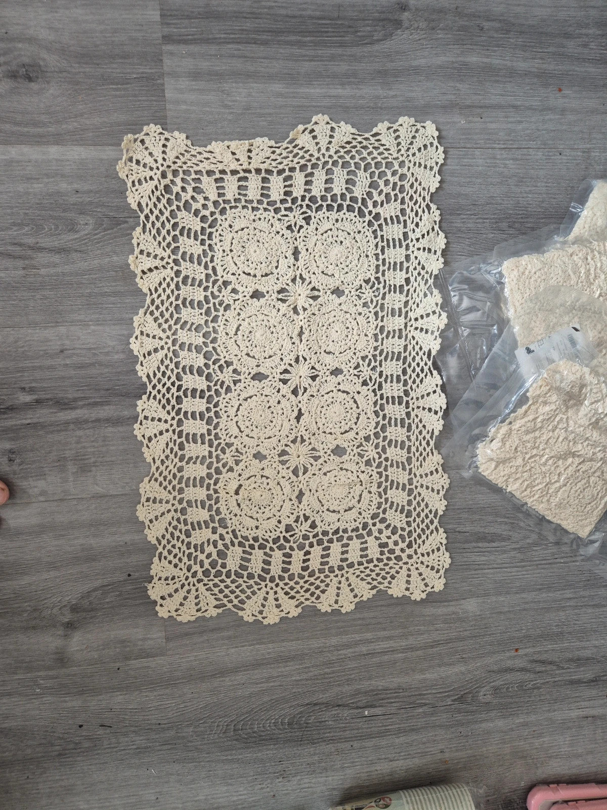 Handmade Beauty cream doilies with elegant openwork floral lace pattern and scalloped edges.