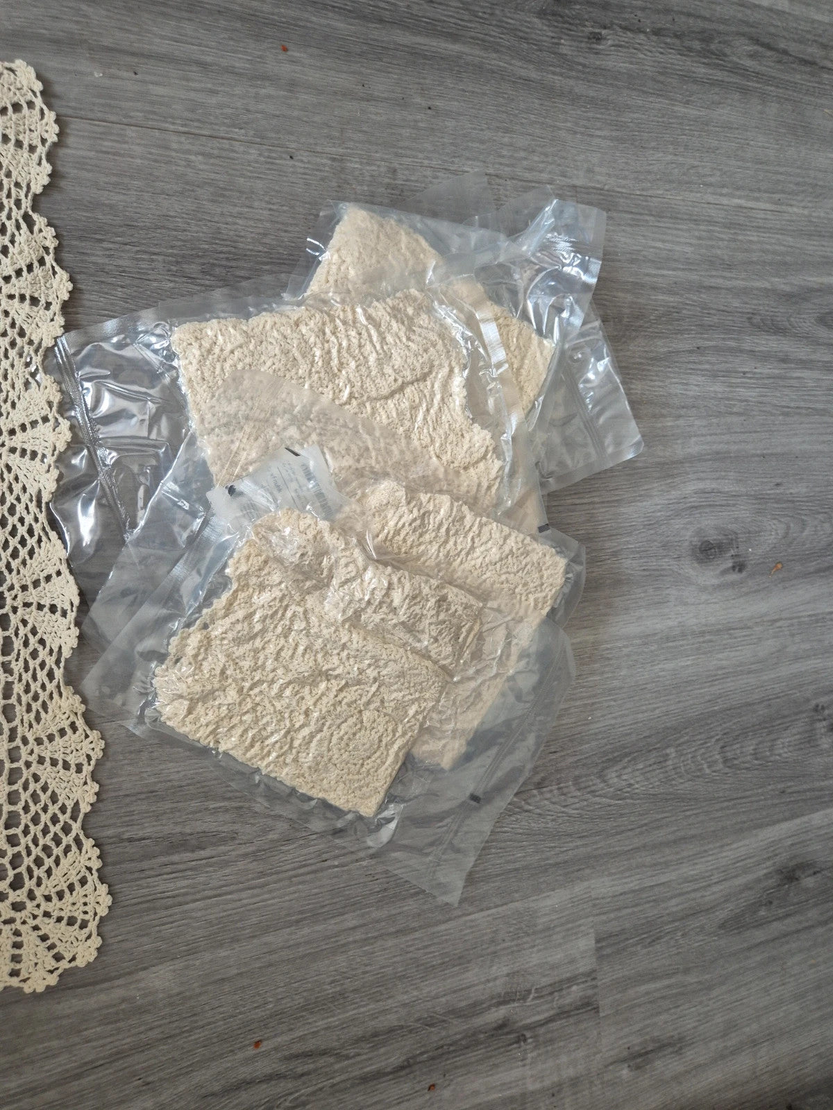 Handmade Beauty cream doilies with elegant openwork floral lace pattern and scalloped edges.