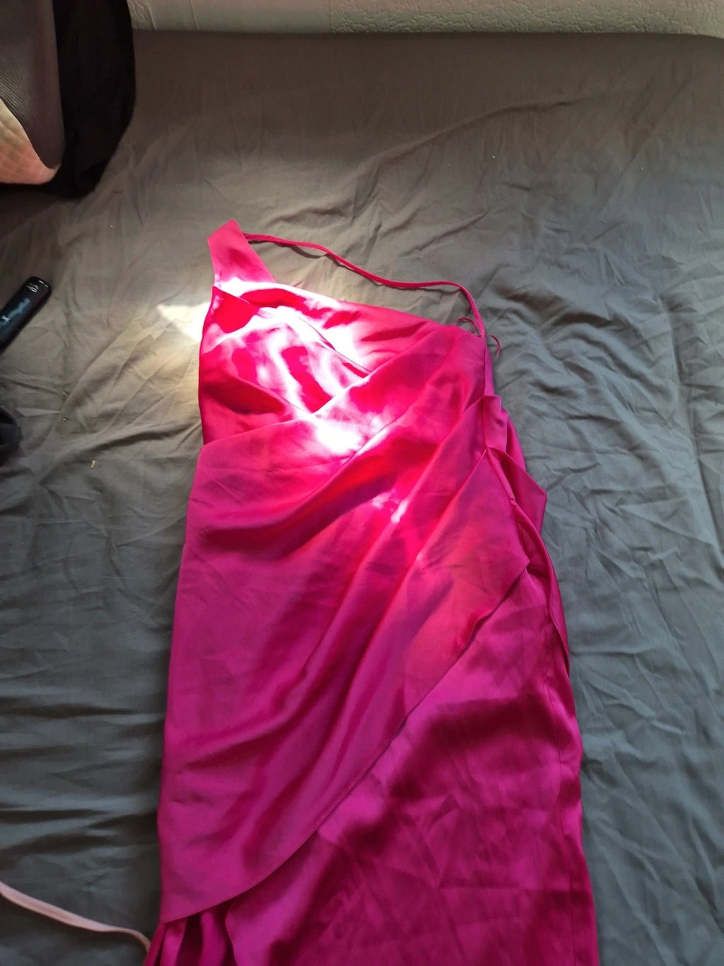 River Island pink bandage dress with structured design and tag attached.