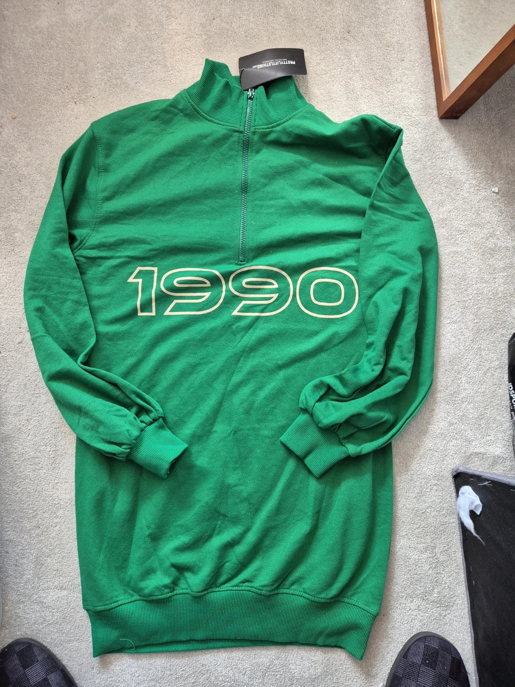 PrettyLittleThing green knit jumper with tags, featuring a soft texture and casual style.