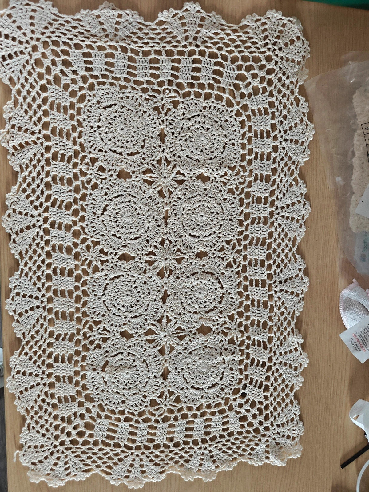 Source Unknown cream tablecloth clips and weights, new in packaging.