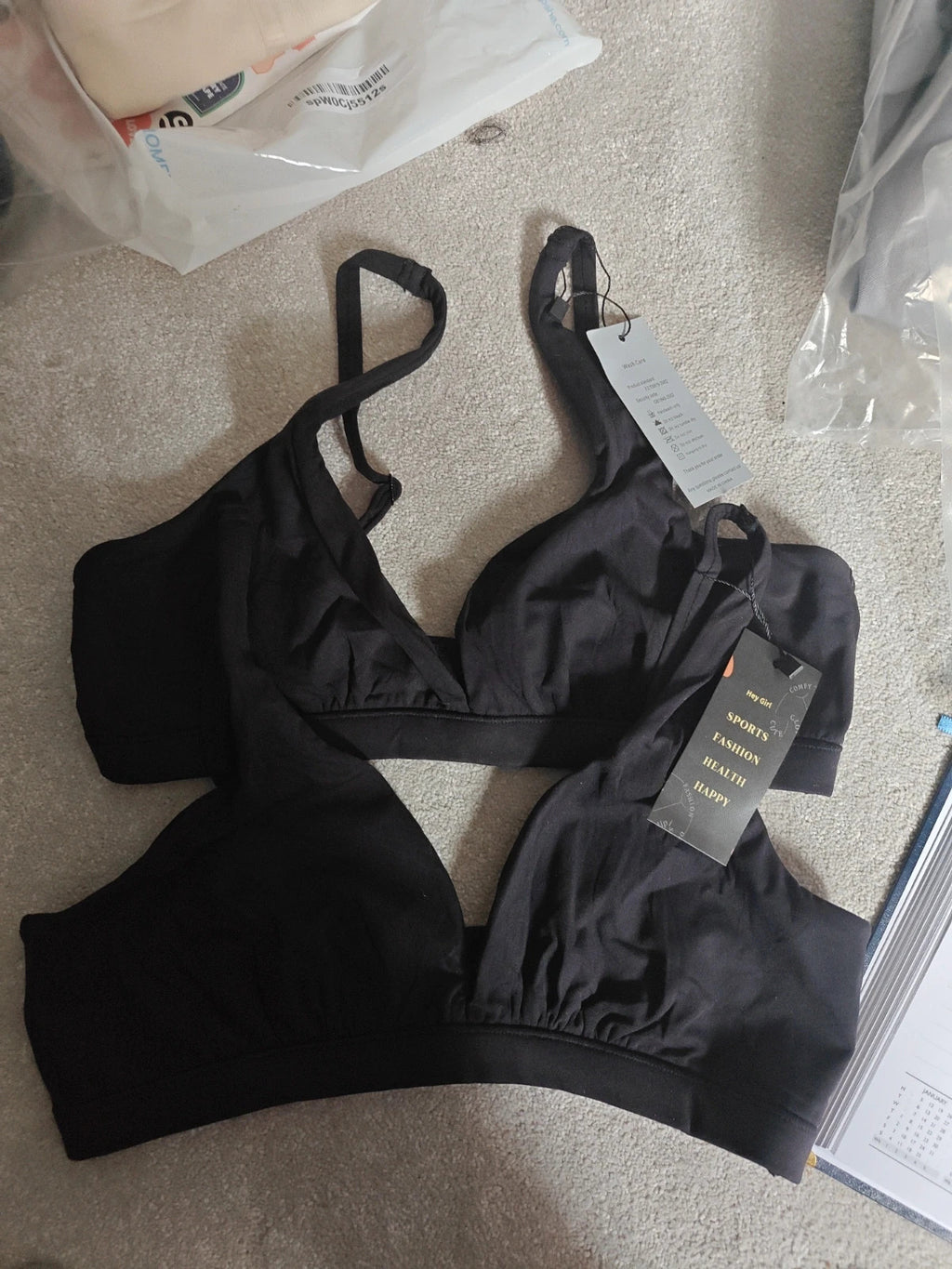 Hey girl black bra size M with new tags and logo detail.