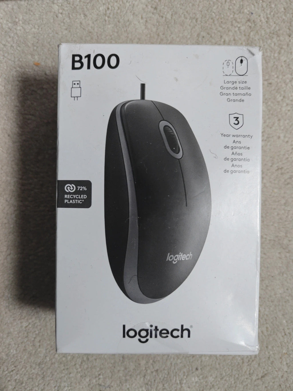 Logitech black mouse with sleek design and ergonomic shape.