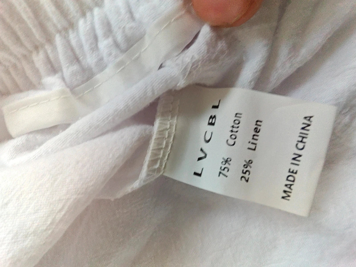 LV Clothing white trousers size medium with clean design and no visible logos.