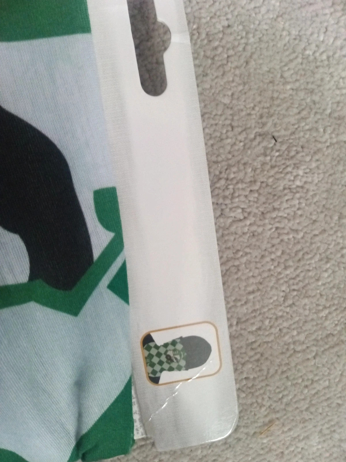 Harry Potter green and white face covering with printed logo and new with tags.
