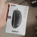 Logitech black mouse with ergonomic design and smooth surface finish.