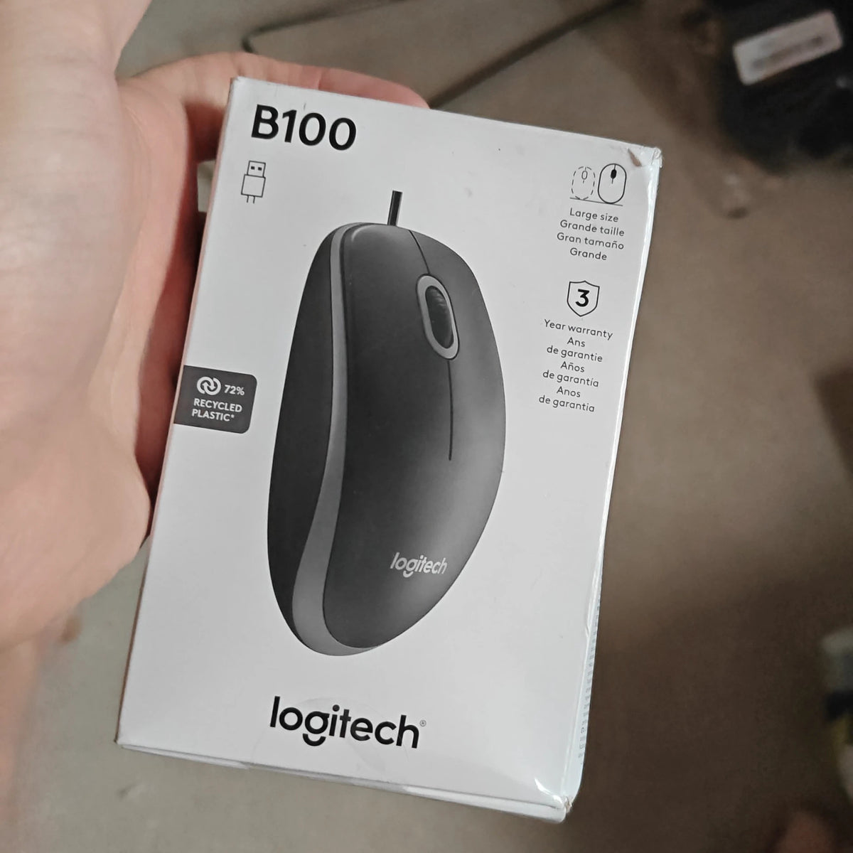Logitech black mouse with ergonomic design and smooth surface finish.