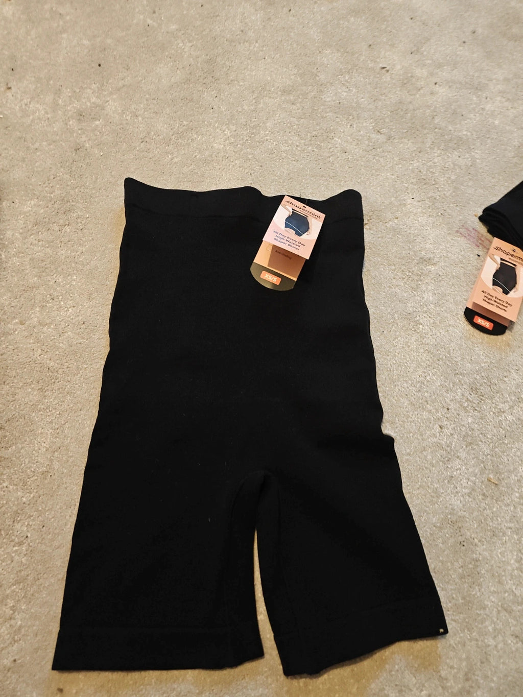 Shapermint beige and black shapewear shorts with tags, size XS/S, smooth fabric.