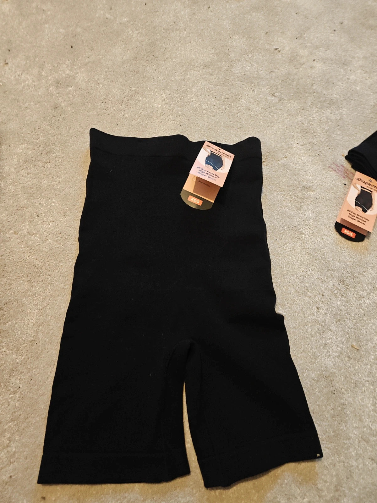 Shapermint beige and black shapewear shorts with tags, size XS/S, smooth fabric.